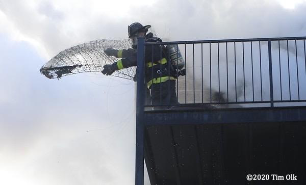 Firefighter discards burned mattress