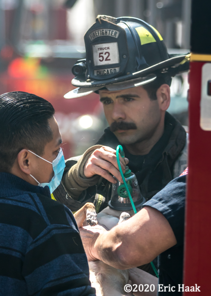 Firefighter assists citizen after a fire