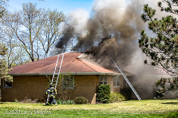 heavy smoke billows from house fire