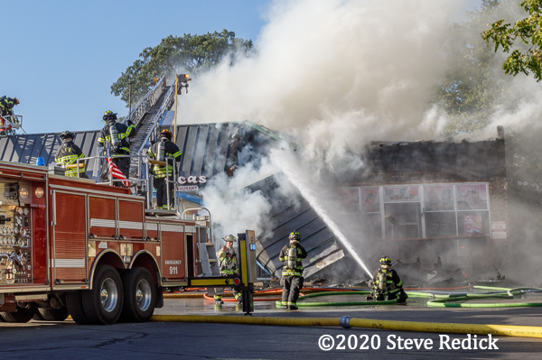 Firefighters battle fire at strip mall