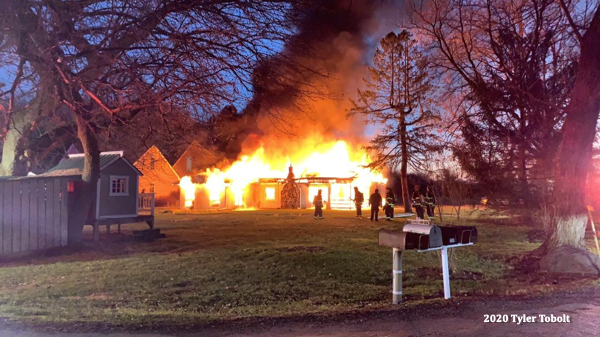 house engulfed in flames