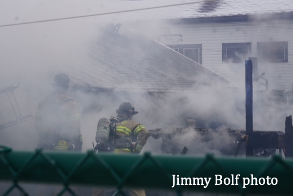 Firefighters with handling immersed in smoke